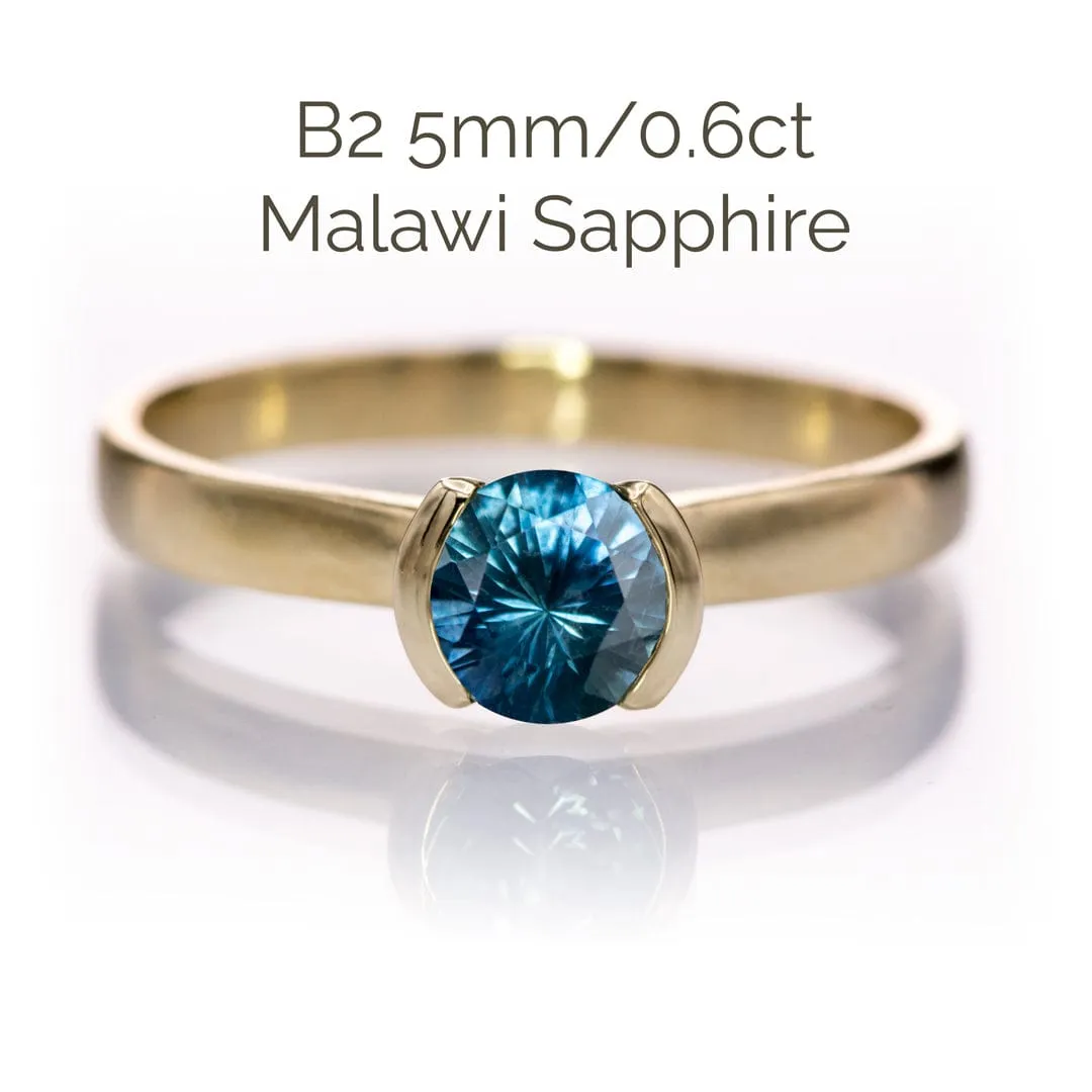 Round Fair Trade Blue/Teal Blue Malawi Sapphire Half Bezel Solitaire Engagement Ring