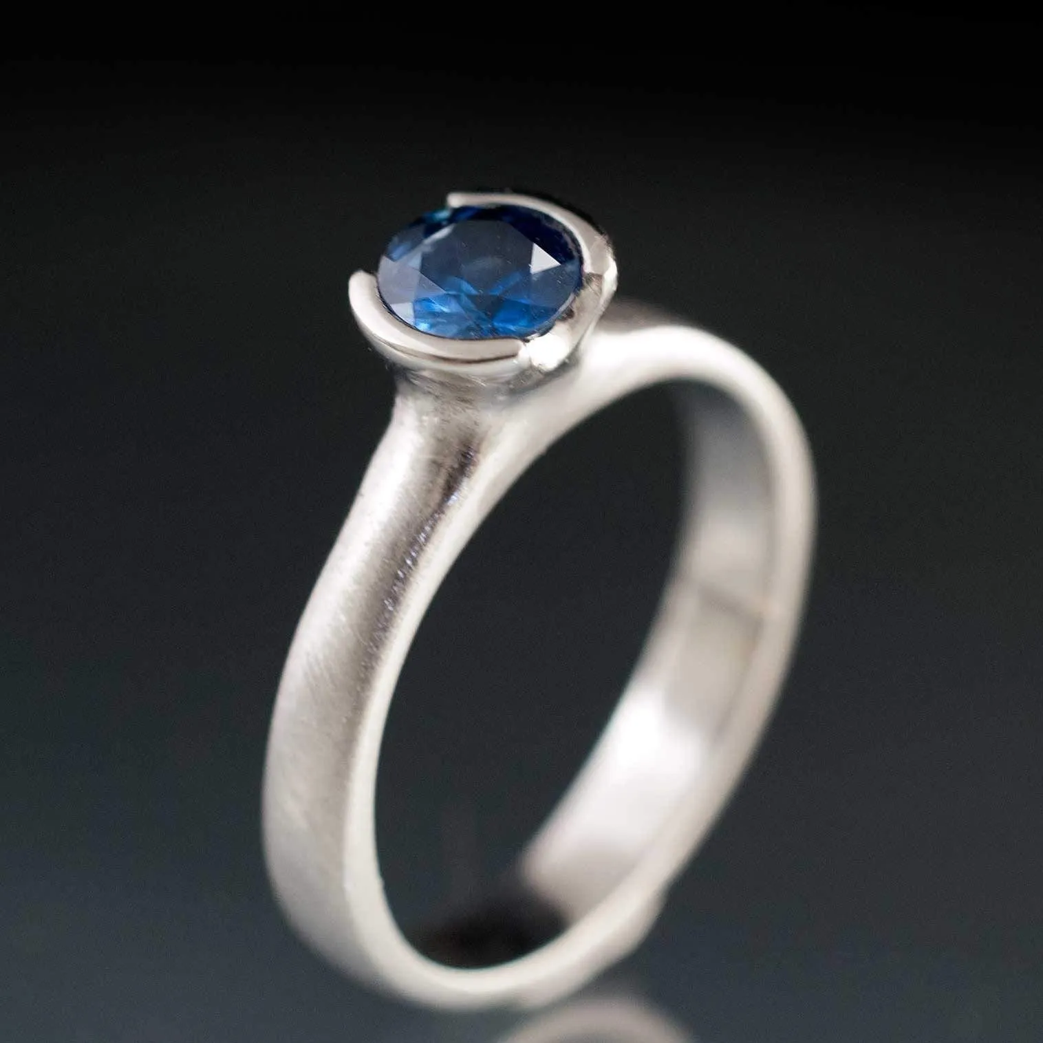 Round Fair Trade Blue/Teal Blue Malawi Sapphire Half Bezel Solitaire Engagement Ring